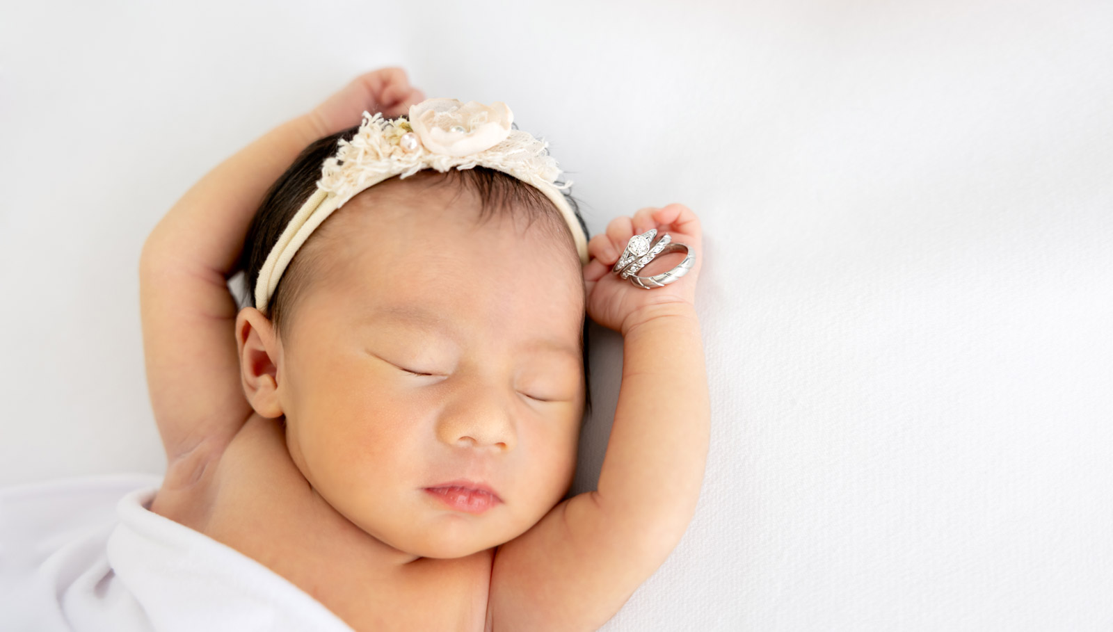 A newborn baby asleep, photographed in the East Victoria Park home studio